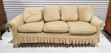 Contemporary three-seater sofa with pale gold damask-style covers and drop-in cushions, on