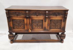 20th century oak sideboard carved in the Elizabethan-style, carved with roses and scrolling