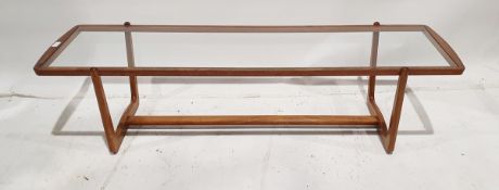Mid 20th century teak and glass long coffee table, rectangular with curved ends, on curved