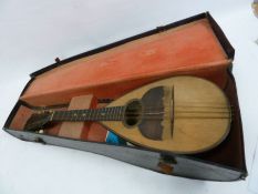 a Mandolin within  fitted case, label  inside the body , F.LL1 Ferrari of Napoli - made in Italy