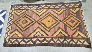 South West Persian Qashgai brown ground kilim with two stepped lozenge medallions enclosed by two