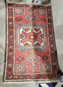 Modern Eastern style cream ground rug with one row of seven elephant foot guls to multiple geometric