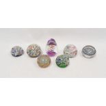 Seven paperweights including a pair of Perthshire scrambled millefiori paperweights, each dated