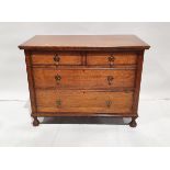 20th century oak chest of two short and two long drawers, on carved circular feet, bulbous