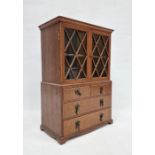 Miniature bookcase on chest of drawers with astragal glazed doors over two short and two long