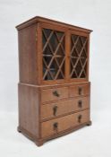 Miniature bookcase on chest of drawers with astragal glazed doors over two short and two long