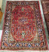 North West Persian Mahal red ground rug with central flowerhead medallion surrounded by floral