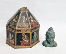 Octagonal Eastern decorated box with seated figures on black background and octagonal pyramidal
