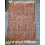 Eastern style red ground rug with geometric pattern to single floral border, 126cm X 87cm