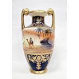 Noritake two-handled vase, 20th century, printed blue marks, painted with Egyptian pyramids and a