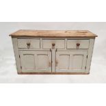 Painted pine kitchen sideboard, the stripped plank top above three drawers and two panelled cupboard