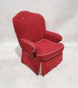 20th century upholstered armchair with arched-shaped back and drop-in cushion upholstered in red