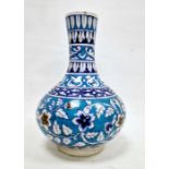 Isnik-style bottle-shaped vase, probably 19th century, decorated with a band of leafy flowers