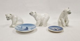 Three Lladro models of polar bears, two modelled seated and the third standing, smallest 10cm