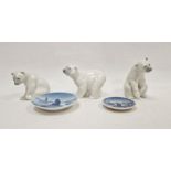 Three Lladro models of polar bears, two modelled seated and the third standing, smallest 10cm