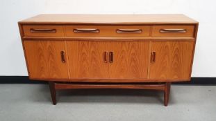 20th century teak E. Gomme for G-plan sideboard of four short drawers over three cupboards on