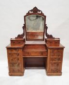 Victorian mahogany dressing table centred by a rectangular bevelled edged mirror, within carved