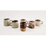 Four studio pottery mugs by the same artist, possibly Andrew Davidson, impressed mark to base,