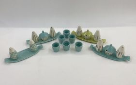 Four Poole pottery three-piece cruet sets in turquoise and green (one missing mustard pot, all