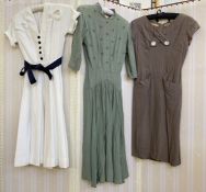 1950's and 60's vintage dresses to include a white poplin shirt waist with navy buttons and navy