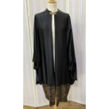 1920's black satin opera cloak with embroidered lame border (possibly continental), filigree brass-