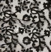A quantity of black lace to include a large shawl, a mantilla veil, trimmings, etc ( 1 box)