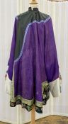 Antique Chinese robe in purple with a turquoise lining and dark green band, deep sleeves with