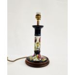 Moorcroft pottery table lamp of candlestick form, mounted on a wooden base, decorated pink