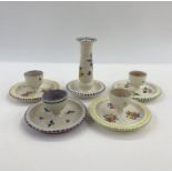 Poole pottery candlestick holder, no.168 to base and four various eggcups, one painted purple and