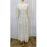 Coco Couture cream lace evening dress trimmed with lace, satin knot button fastening to the front,