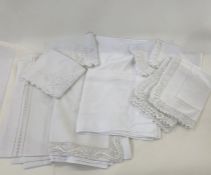 Three pairs of vintage embroidered and lace trimmed pillow cases, three cotton embroidered and cut
