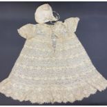 An unbleached machine bobbin lace baby dress, an unbleached lace reticule, a satin and lace baby's