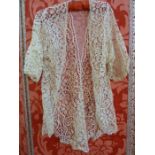 Edwardian machine bobbin lace jacket, and an Edwardian cotton skirt, embroidered, flounced, some