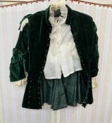 Mid 19th century boy's bottle green velvet jacket, waisted, with frock hem, numerous button details,