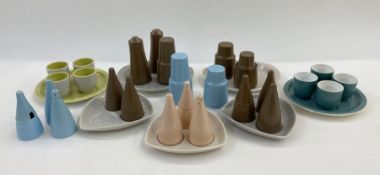 Various Poole pottery cruet sets in brown, pink and blue (2 sets incomplete) and two circular eggcup