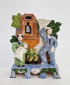 20th century earthenware Staffordshire group  'Tee Total', a couple with child seated by tea