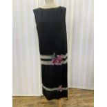 1920's black silk dress with elaborate beaded drop waist, banded in silver, black and grey, with