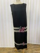 1920's black silk dress with elaborate beaded drop waist, banded in silver, black and grey, with