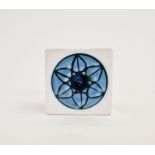 Troika cube vase with white ground, blue circular floral motif, marked to base 'Troika Cornwall