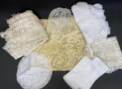 Quantity of white table mats, doilies, drawn thread and crochet work tablecloth, quilted and