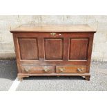 Oak Georgian-style mule chest with hinged plank top, above panelled front and sides and two drawers,
