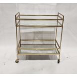 Modern metal and glass two-tier trolley, 70cm wide and a modern circular quartz occasional table (2)