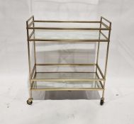 Modern metal and glass two-tier trolley, 70cm wide and a modern circular quartz occasional table (2)