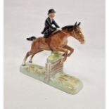 Beswick pottery model of a horse and rider jumping a fence, printed black marks, the female rider