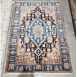 North west Persian pink and navy ground Nahawand rug with central geometric medallion, single