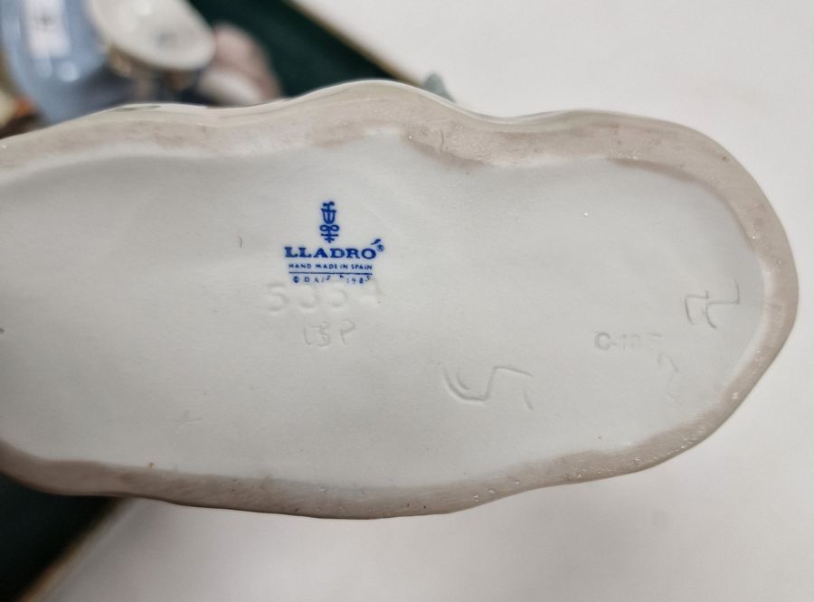 Five Lladro figures including a boy and girl riding a donkey, a pair of girls with baskets of - Image 7 of 10