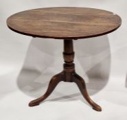 Georgian oak tilt-top tripod table on scroll supports, 82cm diameter