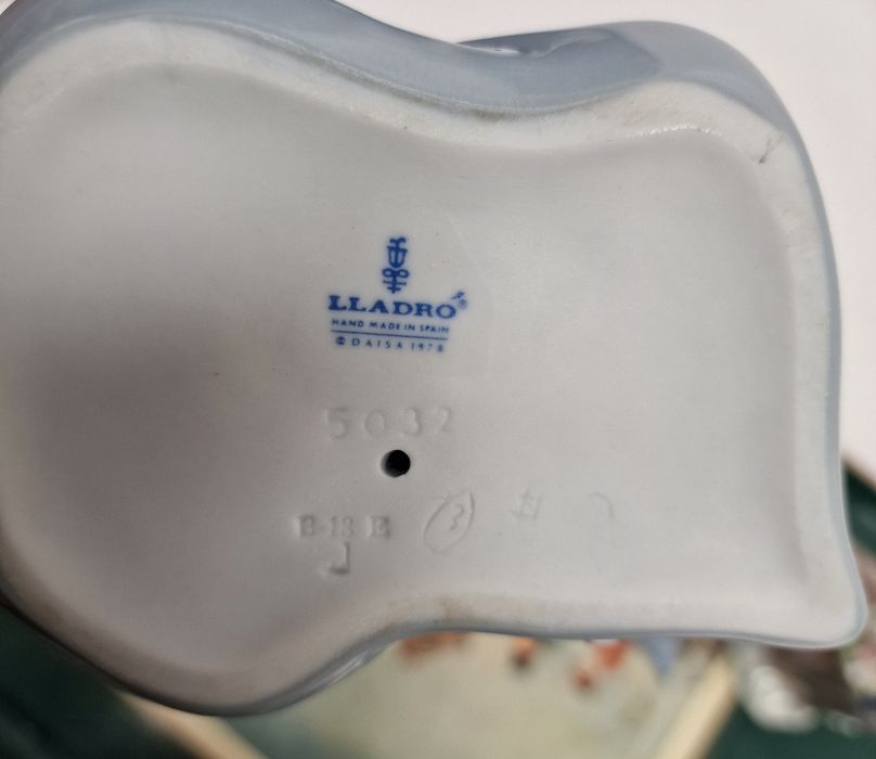 Five Lladro figures including a boy and girl riding a donkey, a pair of girls with baskets of - Image 4 of 10