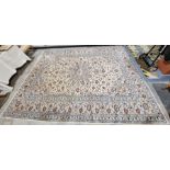 Central Persian cream ground Kashan carpet with large ivory central floral medallion on herati