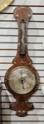 Early 19th century banjo barometer, the rosewood case inlaid with floral mother of pearl motifs,